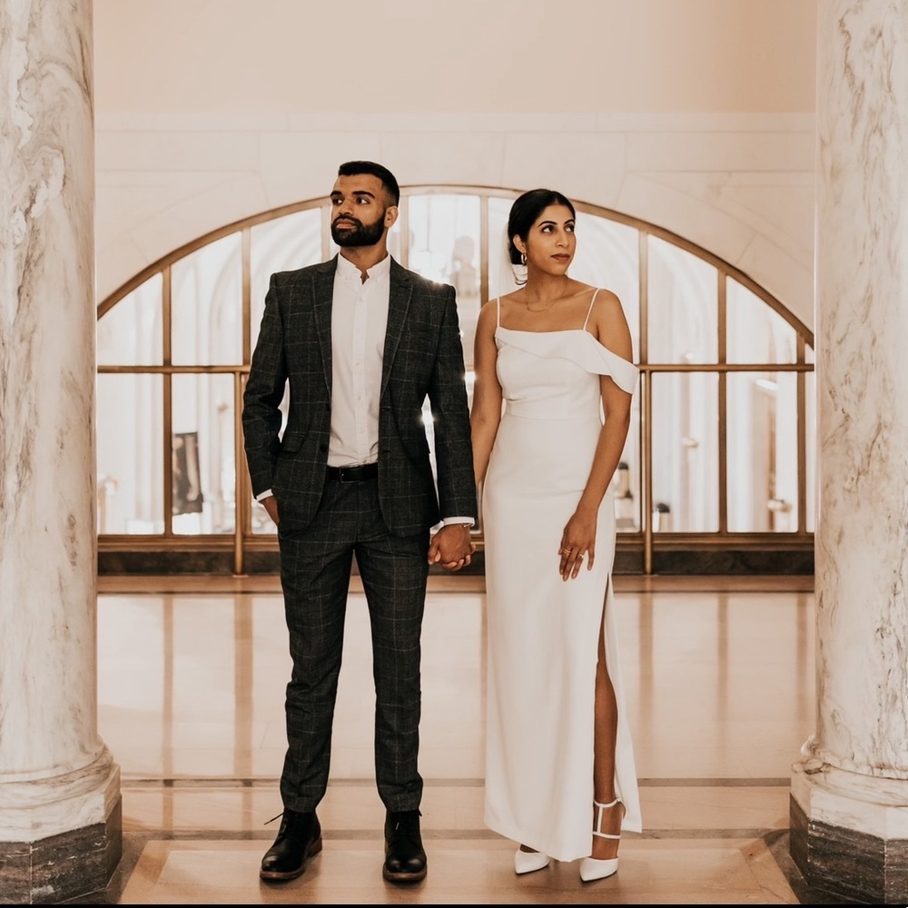 Asymmetrical off the shoulder white dress with slit